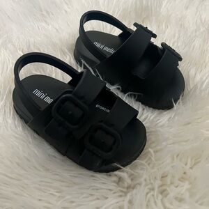 Mini Melissa’s black size 6 baby shoe